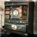 D12. Black lacquer Asian jewelry box with gold decoration. 